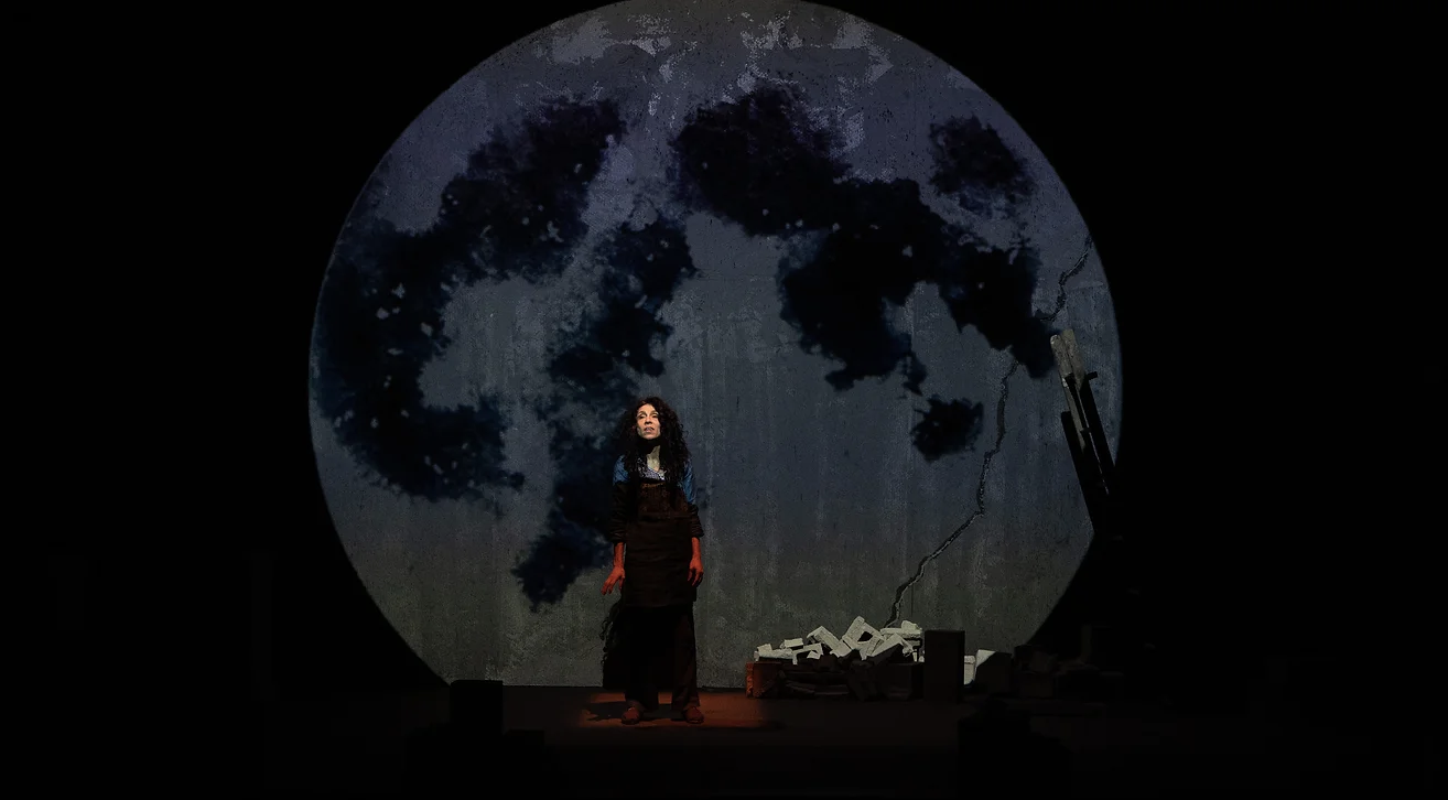 Woman In Front A Huge Projection Of A Full Moon